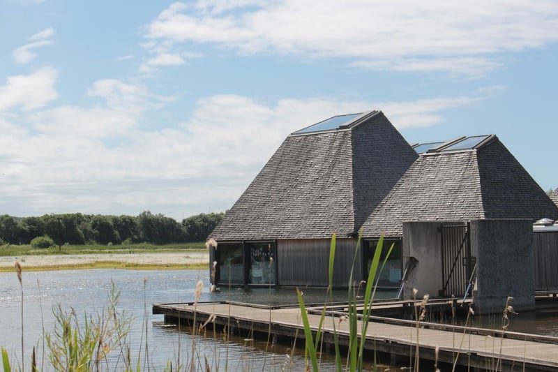 Wetland and woodland nature reserve, home to rare bird species, with a floating visitor village