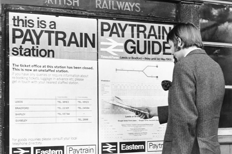 A passenger studies details of the new Pay Trains service at Ilkley Station in October 1968.
