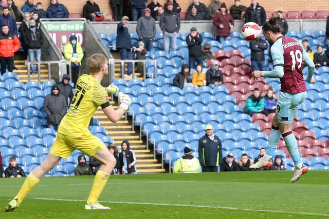 Burnley's Jay Rodriguez scores the opening goal beating Huddersfield Town's Ryan Schofield.