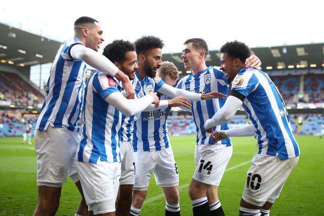 Josh Koroma of Huddersfield Town celebrates with teammates after scoring their team's first goal during the Emirates FA Cup Third Round match between Burnley and Huddersfield Town at Turf Moor on January 08, 2022 in Burnley, England.