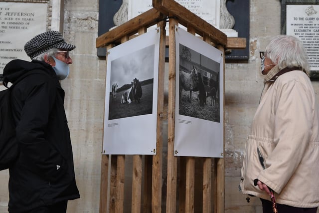 Visitors to the Cathedral view the Women in Farming Network's photography exhibition 'All in a Day's Work'