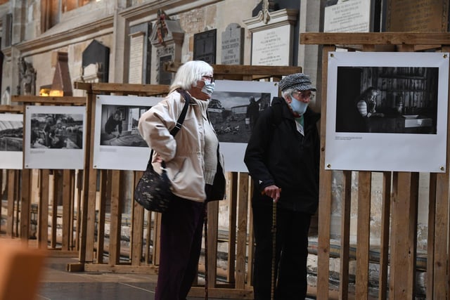 Visitors to the Cathedral view the Women in Farming Network's photography exhibition 'All in a Day's Work'