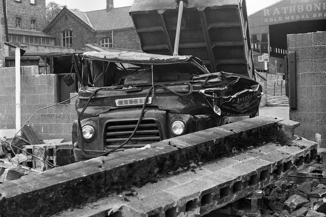 The crushed cab of the lorry in which Wigan Rugby League Club director, Eric Ayles, was killed after a concrete post fell on the vehicle near a gateway at Central Park where the old Douglas stand was being demolished on Thursday 25th of May 1972.