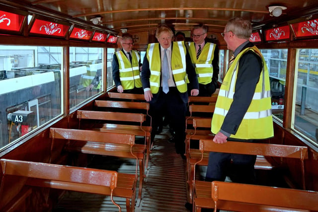Boris Johnson and Communities Secretary Michael Gove viewing a vintage tram