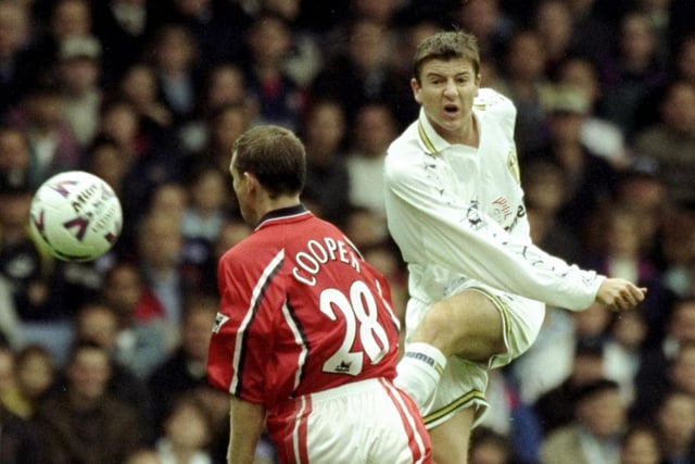 Michael Bridges gets in a shot despite heavy pressure from Middlesbrough's Colin Cooper during the Premiership clash at Elland Road in September 1999. Leeds won 2-0.