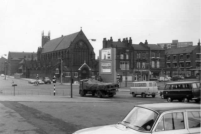 Woodpecker Junction showing St. Patrick's Roman Catholic Church located in New York Road in 1964. Properties from the centre to the right are in Burmantofts Street and traffic approaching the junction from the right is in York Road. Marsh Lane goes off left just below the centre of the left edge. The photograph is taken from near the Woodpecker Inn.