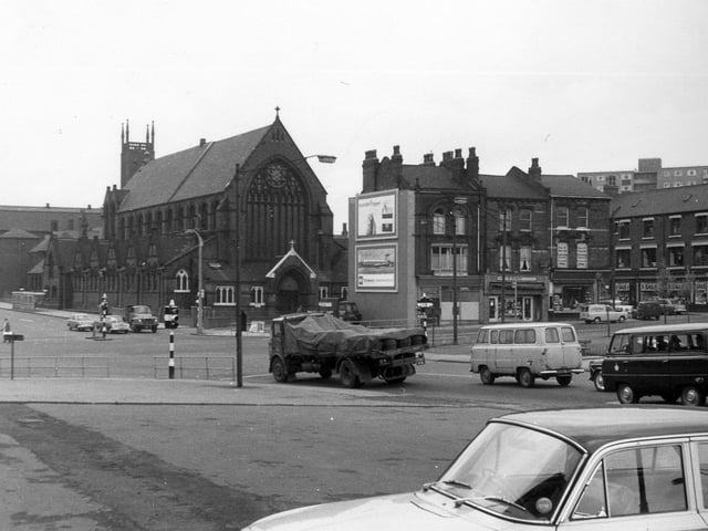 Woodpecker Junction showing St. Patrick's Roman Catholic Church located in New York Road in 1964. Properties from the centre to the right are in Burmantofts Street and traffic approaching the junction from the right is in York Road. Marsh Lane goes off left just below the centre of the left edge. The photograph is taken from near the Woodpecker Inn.