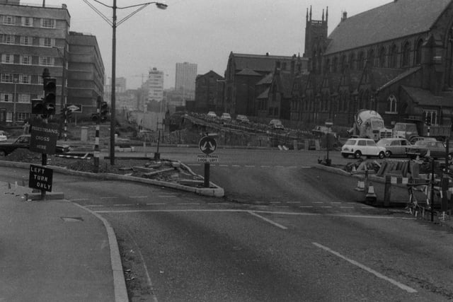 York Road at the Woodpecker Junction looking towards New York Road and the flyover and into the city centre in the early 1970s.  Quarry Hill Flats, which were soon to be demolished, are on the left, with Kitson House facing forward onto Marsh Lane and Lupton House facing towards the right.