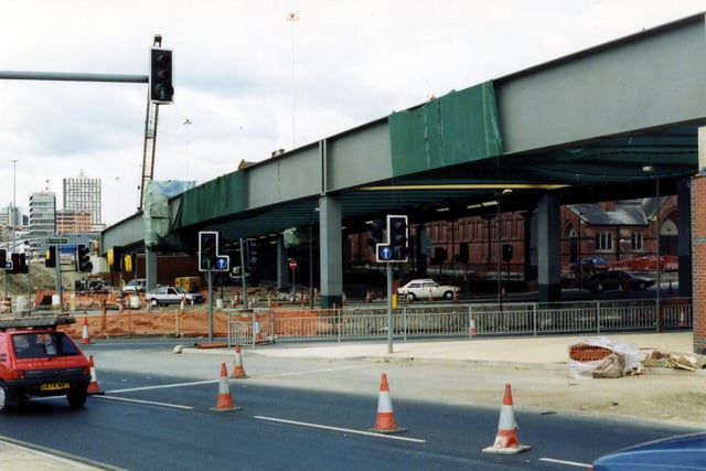 The Woodpecker Junction looking north-west showing the £7.5 million scheme in 1991/92. Stage 5 of the Inner Ring Road is well underway. In the foreground is the slip-road from the A64. The westbound flyover is in the process of being constructed and beneath it St. Patrick's Chapel in New York Road can be seen. The Roman Catholic Church is built in red brick and opened in 1891.