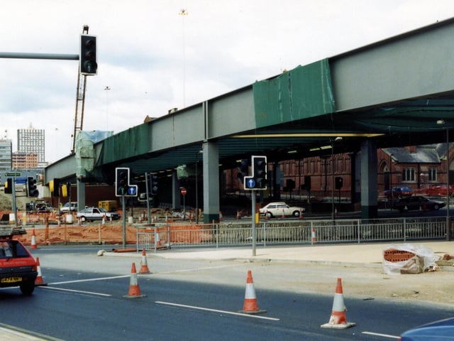 The Woodpecker Junction looking north-west showing the £7.5 million scheme in 1991/92. Stage 5 of the Inner Ring Road is well underway. In the foreground is the slip-road from the A64. The westbound flyover is in the process of being constructed and beneath it St. Patrick's Chapel in New York Road can be seen. The Roman Catholic Church is built in red brick and opened in 1891.