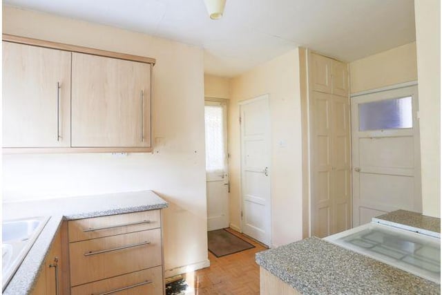The fitted kitchen is smaller but still offers plenty of space to cook.