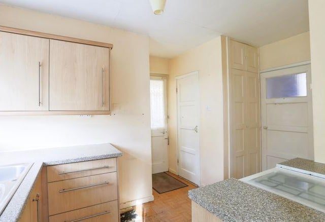 The fitted kitchen is smaller but still offers plenty of space to cook.