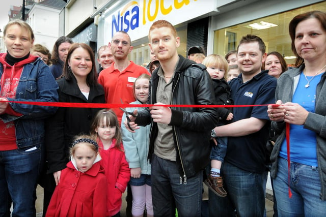 Coronation Street actor Mikey North, centre, cuts the ribbon to officially open the new Nisa store with Veronica Wilson, Craig Wilson and Daniel Wilson.