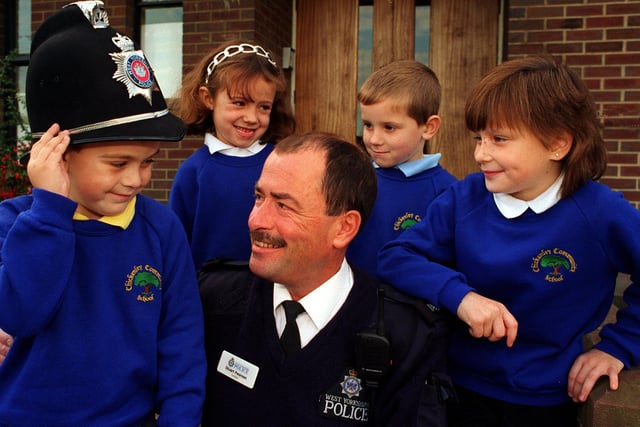 West Yorkshire Police at Chickenley Junior School, PC Stuart Pearson, Community Officer for Chickenley and Earlsheaton with, from left, Lee Tindall, Amy Driver, Ashley Joy, Melissa Smith. 1997.