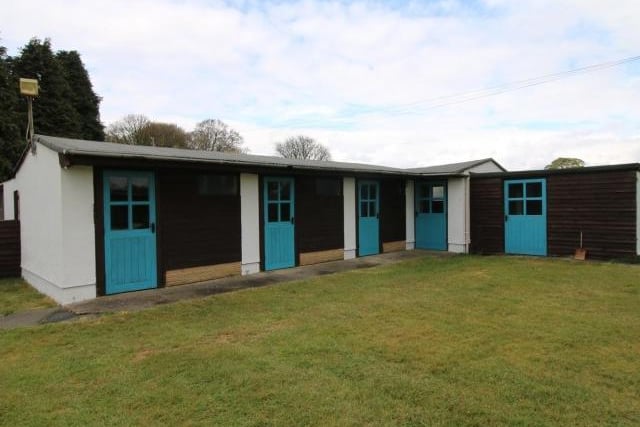 The outbuildings currently include 69 individual dog kennels and 59 cat pens, a detached garage, facilities to stable horses and a further building that was previously used as a dog grooming parlour.
