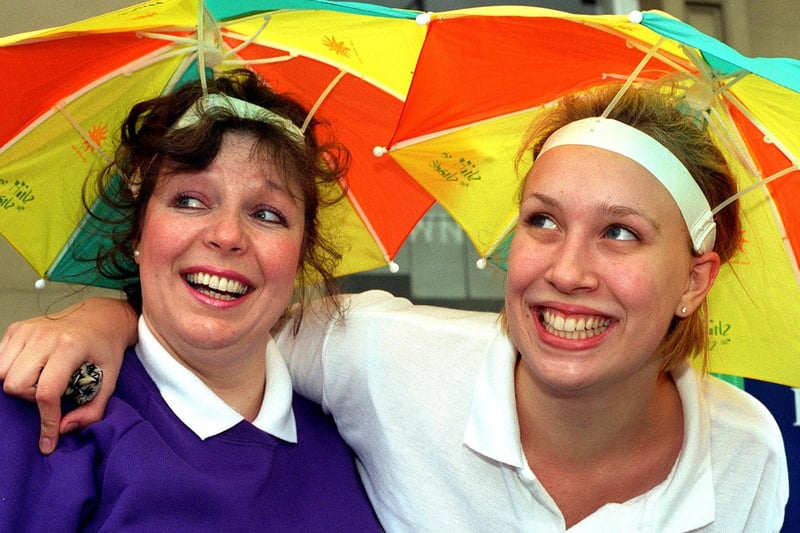Wendy Moorhouse (left) and Heather Buckley are pictured at Batley Bash wear  sunshades in Batley market place.