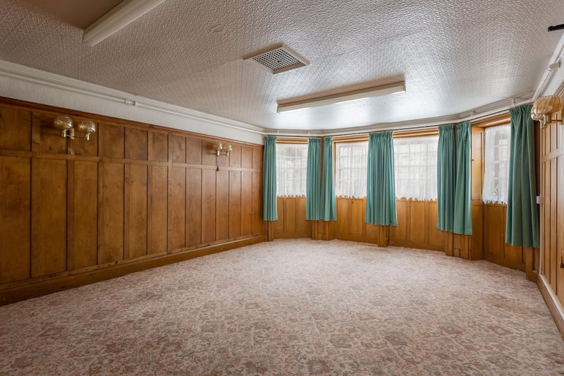 This room boasts original wood panelling