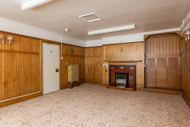 A reception room with panelled walls