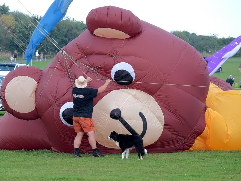 Last minute adjustments before the Oscar, the biggest teddy bear kite in the world takes flight.