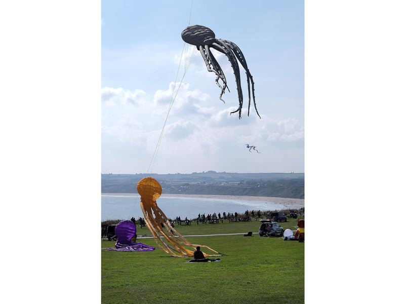 Kites fly high above Filey beach.