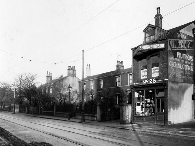 Headingley Lane in November 1937. Spink and Simpson plumbers and electricians are pictured. To the left is residence and office of Joseph Leonard Iredale surgeon.