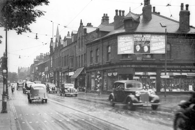 Otley Road looking towards junction with North Lane in June 1937. Shoppers and Motor vehicles can be seen on the street. Myers store can be seen on the left.