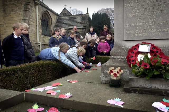 Pupils from Thorner School lay poppies during the Remembrance Service in Thorner.