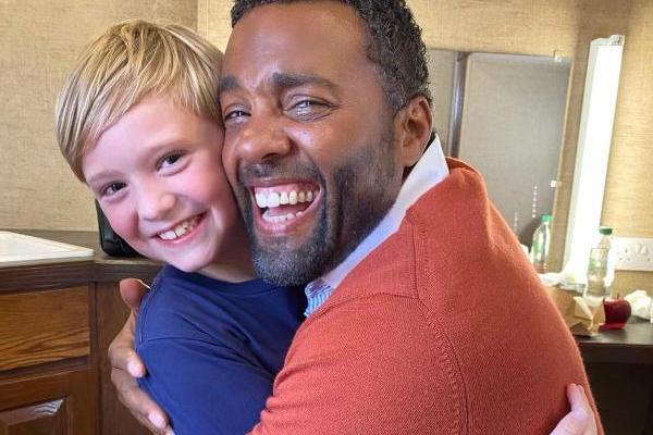 Oliver Smith who plays Henry Christmas-Hope with actor Ray Fearon on set