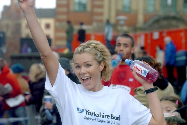 Leeds model Nell McAndrew is pictured celebrating after completing the Abbey Dash.