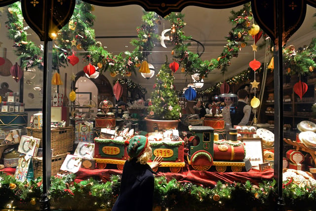 Bettys reveals its Christmas windows in 2018.  Pictured admring the display is Agnes O'Connor,  7, from  Marton cum Grafton