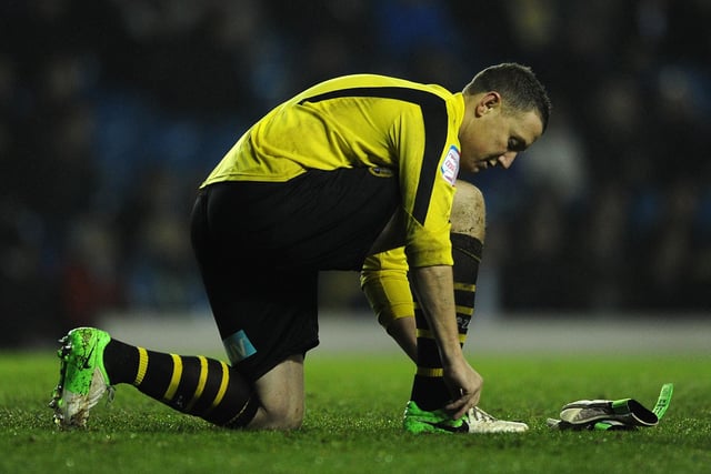 Paddy Kenny ties his bootlaces during the Championship clash against Middlesbrough at Elland Road in December 2012.