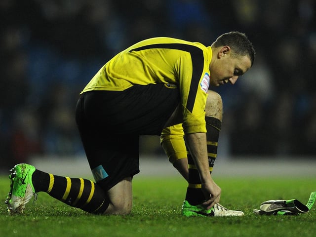 Paddy Kenny ties his bootlaces during the Championship clash against Middlesbrough at Elland Road in December 2012.