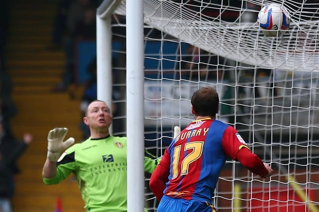 Crystal Palace striker Glenn Murray scores past Paddy Kenny during the Championship clash at Selhurst Park in March 2013.