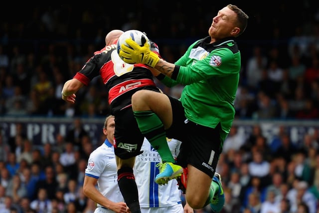 Paddy Kenny claims the ball under pressure from Queens Park Rangers striker Andrew Johnson during the Championship clash in August 2013.
