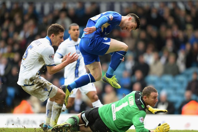 Leicester City striker David Nugent jumps over Paddy Kenny as he scores during the Championship clash at Elland Road in January 2014.