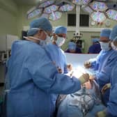 A surgeon and his theatre team perform key hole surgery at The Queen Elizabeth Hospital in Birmingham. Picture: Christopher Furlong/Getty Images