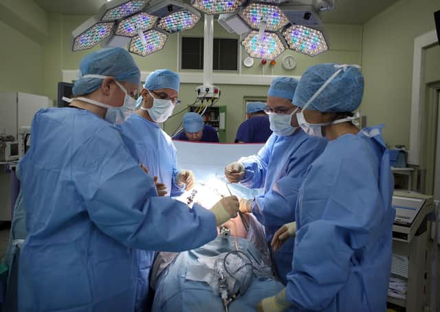 A surgeon and his theatre team perform key hole surgery at The Queen Elizabeth Hospital in Birmingham. Picture: Christopher Furlong/Getty Images