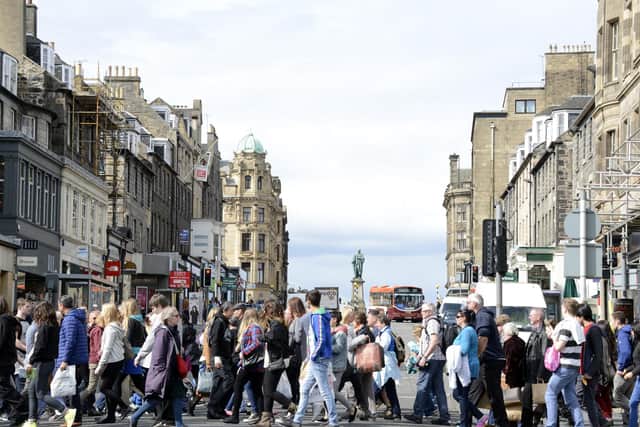 Shoppers on Princes Street in Edinburgh. Rishi Sunak has not ruled out every person in the UK being issued with a 500 pound voucher to spend on the high street. Picture: Andy O'Brien