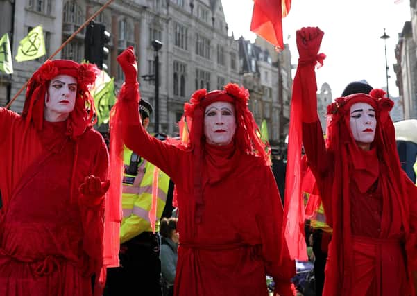 Extinction Rebellion protesters have been calling for divestment in fossil fuel companies (Picture: Isabel Infantes/AFP via Getty Images)