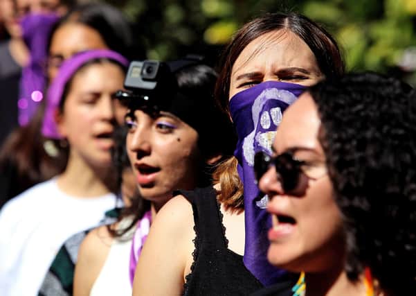 Students sing ‘El violador eres tú’ (The rapist, is you) – a song by the Chilean feminist collective Las Tesis – during a demonstration against gender violence and patriarchy in Guadalajara, Mexico, ahead of International Women’s Day (Picture: Ulises Ruiz/ via Getty Images)