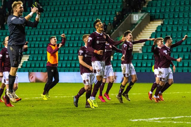 The jubilant Hearts players celebrate an Edinburgh derby win