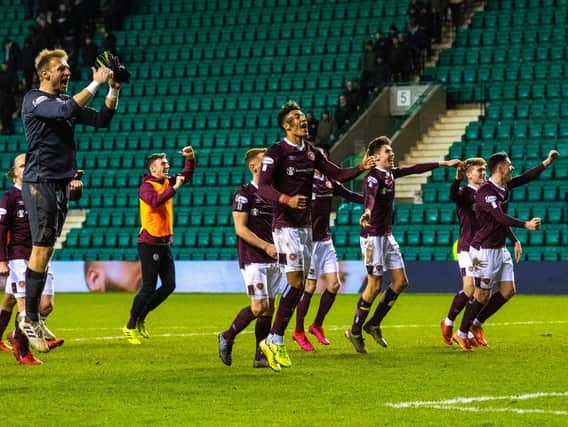 The jubilant Hearts players celebrate an Edinburgh derby win
