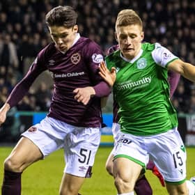 Hibs' Greg Docherty and Hearts defender Aaron Hickey (left) vie for possession during the Easter Road derby