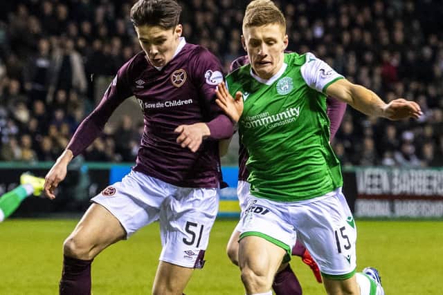 Hibs' Greg Docherty and Hearts defender Aaron Hickey (left) vie for possession during the Easter Road derby