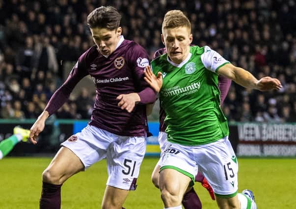 Hibs' Greg Docherty and Hearts defender Aaron Hickey (left) vie for possession during the Easter Road derby