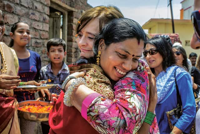 Cherie Blair hugs Foundation beneficiary Dhanashree