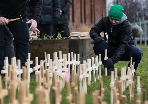 Crosses are set up at Glasgow’s Springburn Parish Church in memory of those who died from drugs (Picture: John Devlin)