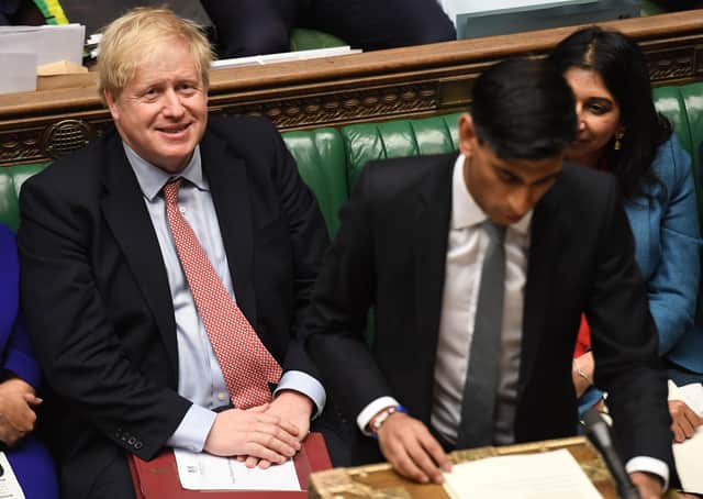Boris Johnson smiles as Chancellor Rishi Sunak delivers his 2020 spring budget statement (Picture: Jessica Taylor/UK Parliament/AFP via Getty Images)