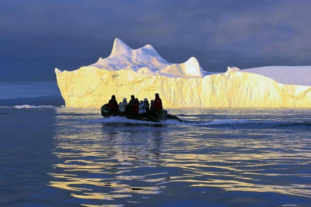 One of the ship's 20 zodiacs gives passengers a closer view of an iceberg