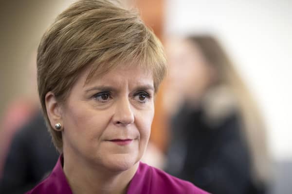 Nicola Sturgeon and Boris Johnson need to work to win approval for next phase of lockdown from opposition parties (Picture: Jane Barlow/pool/AFP via Getty Images)